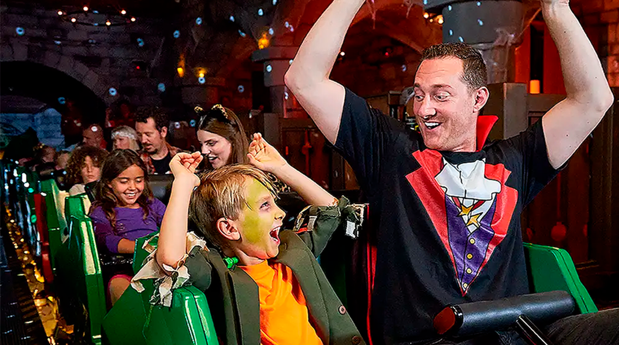 Father and son dressed for Halloween riding Legoland ride