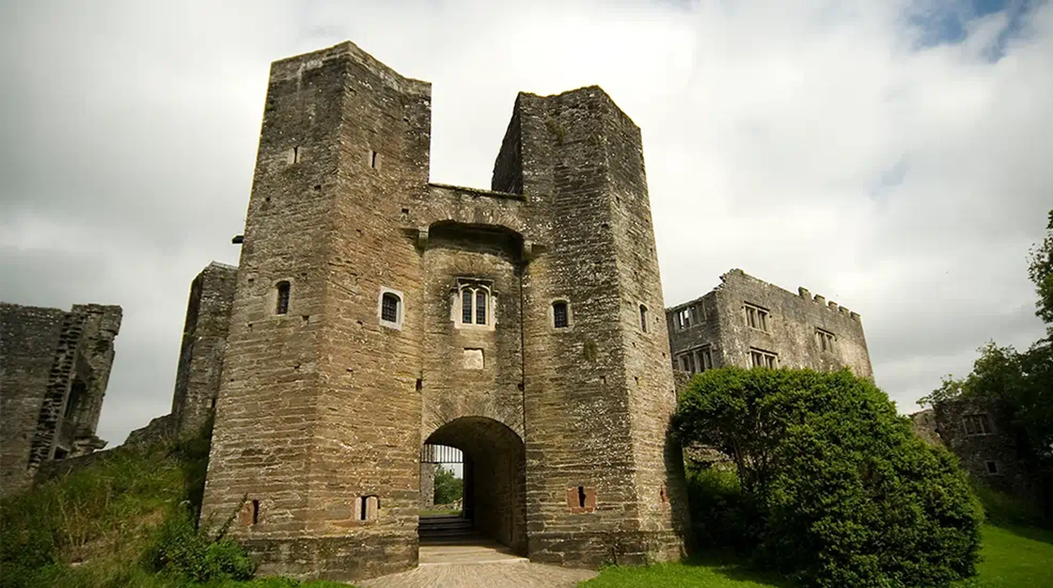 Medieval stone castle with tall towers and arched entrance