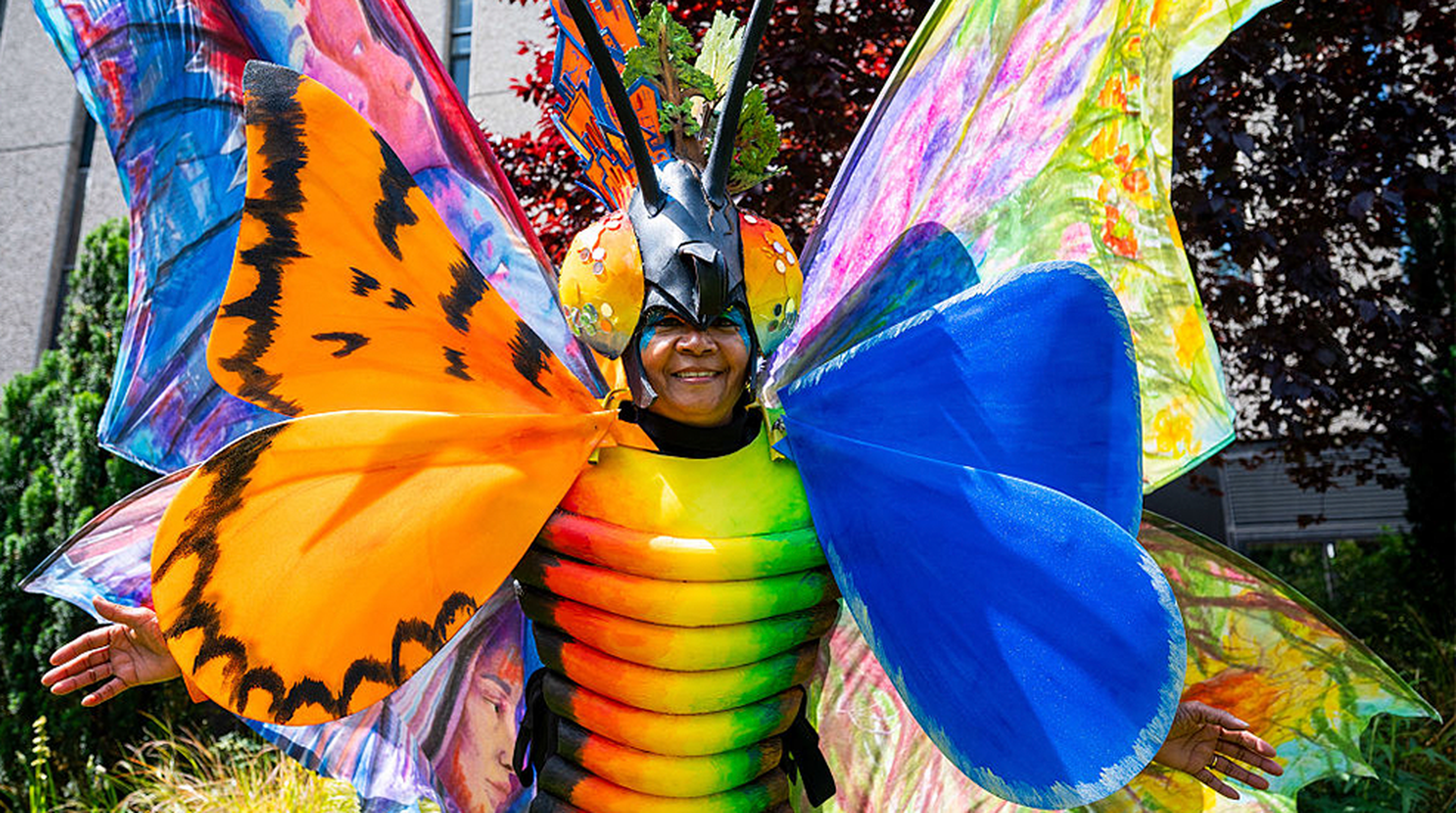 Clary Salandy unveils an immense colourful butterfly costume with 4 meter high wings at Imperial College London on the eve of the Great Exhibition Road in South Kensington on June 06, 2025