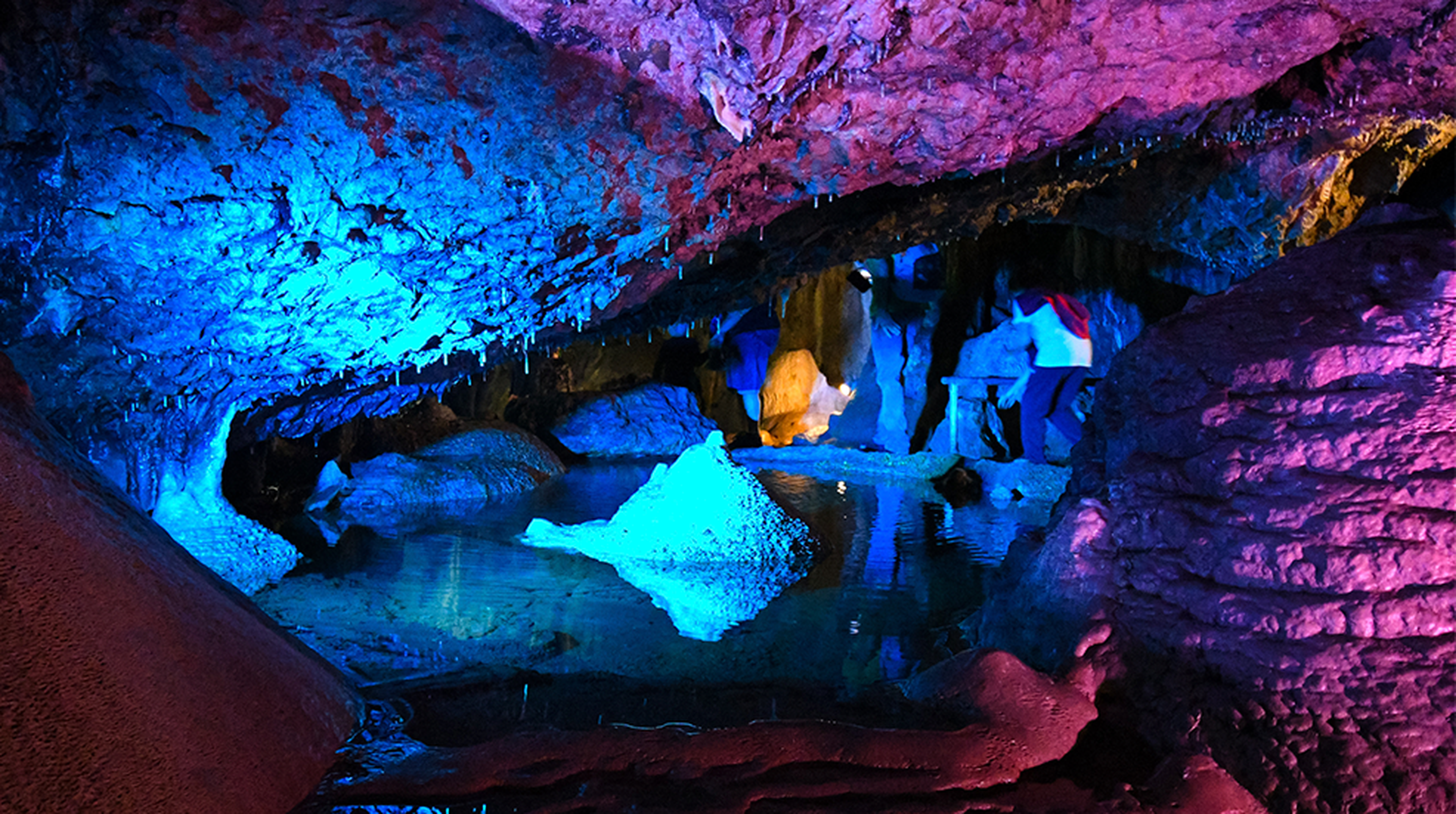 A dramatically lit lake in the caves of Wookey Hole