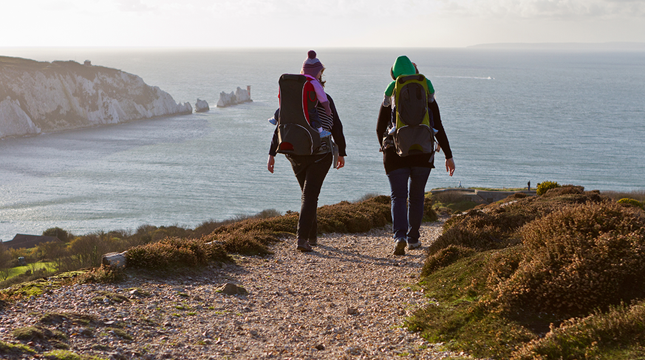 Coastal walk on Headon Warren overlooking alum bay and Needles, with couple of happy mums and babies.