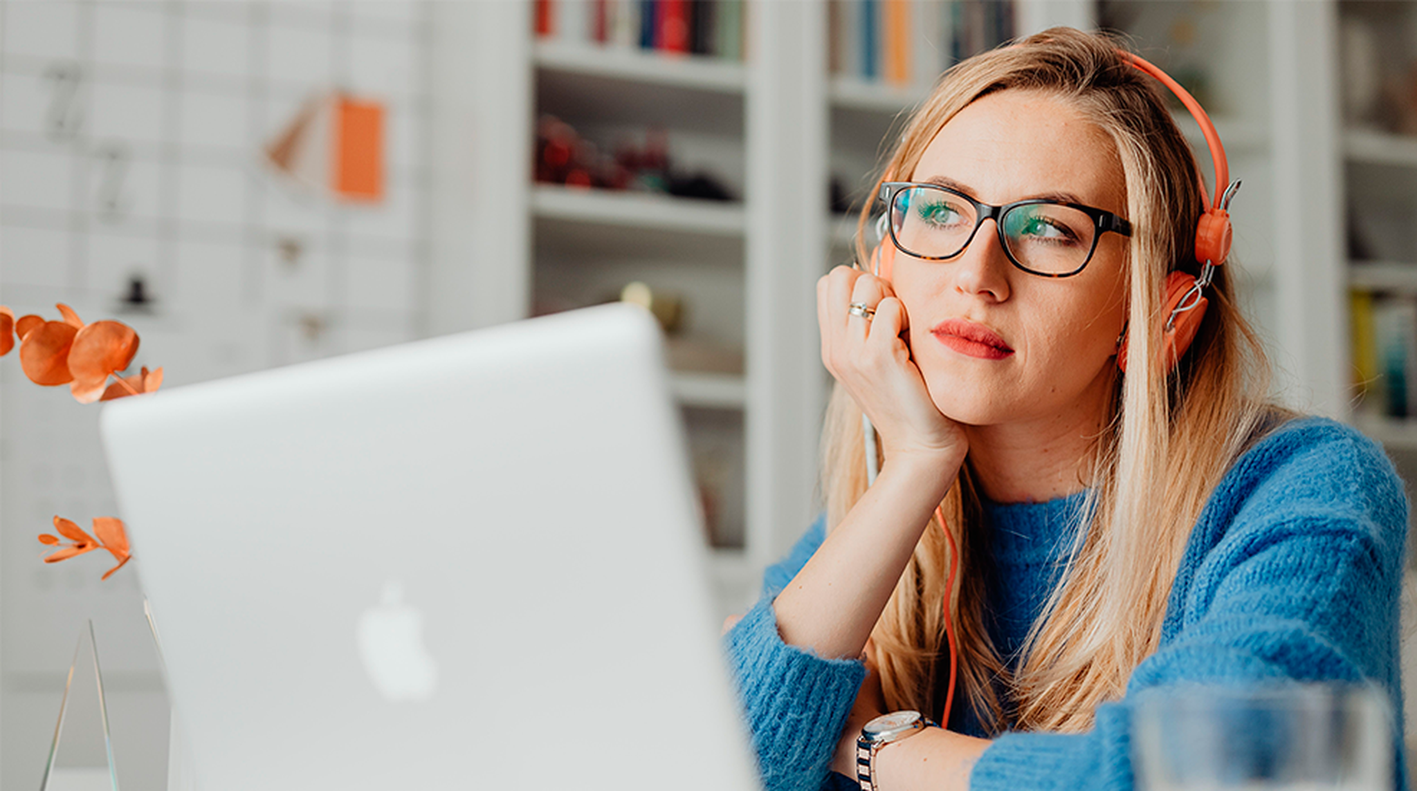 Girl with headphones on at laptop