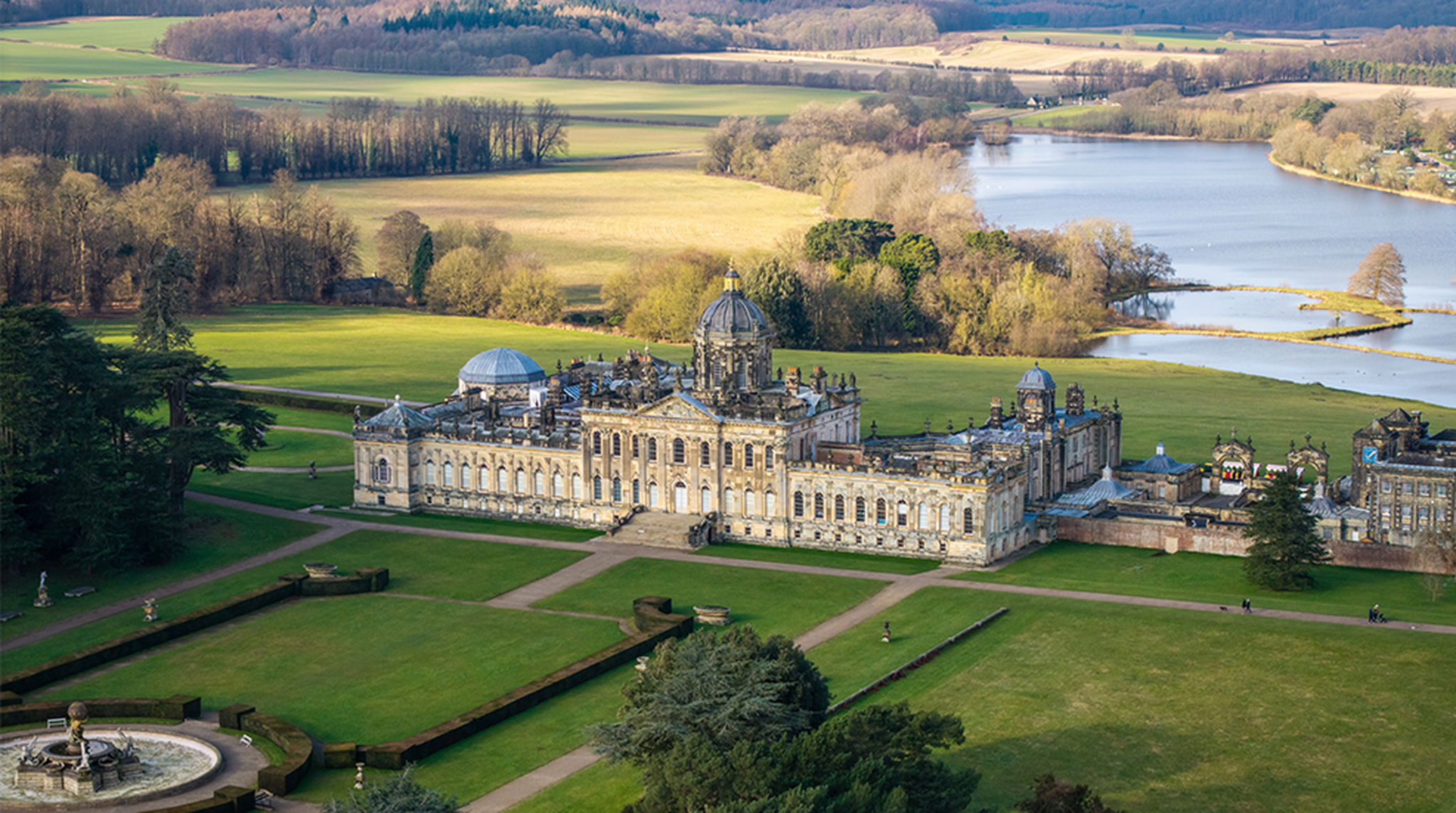 Aerial view of Castle Howard stately home in North Yorkshire with gardens and lake