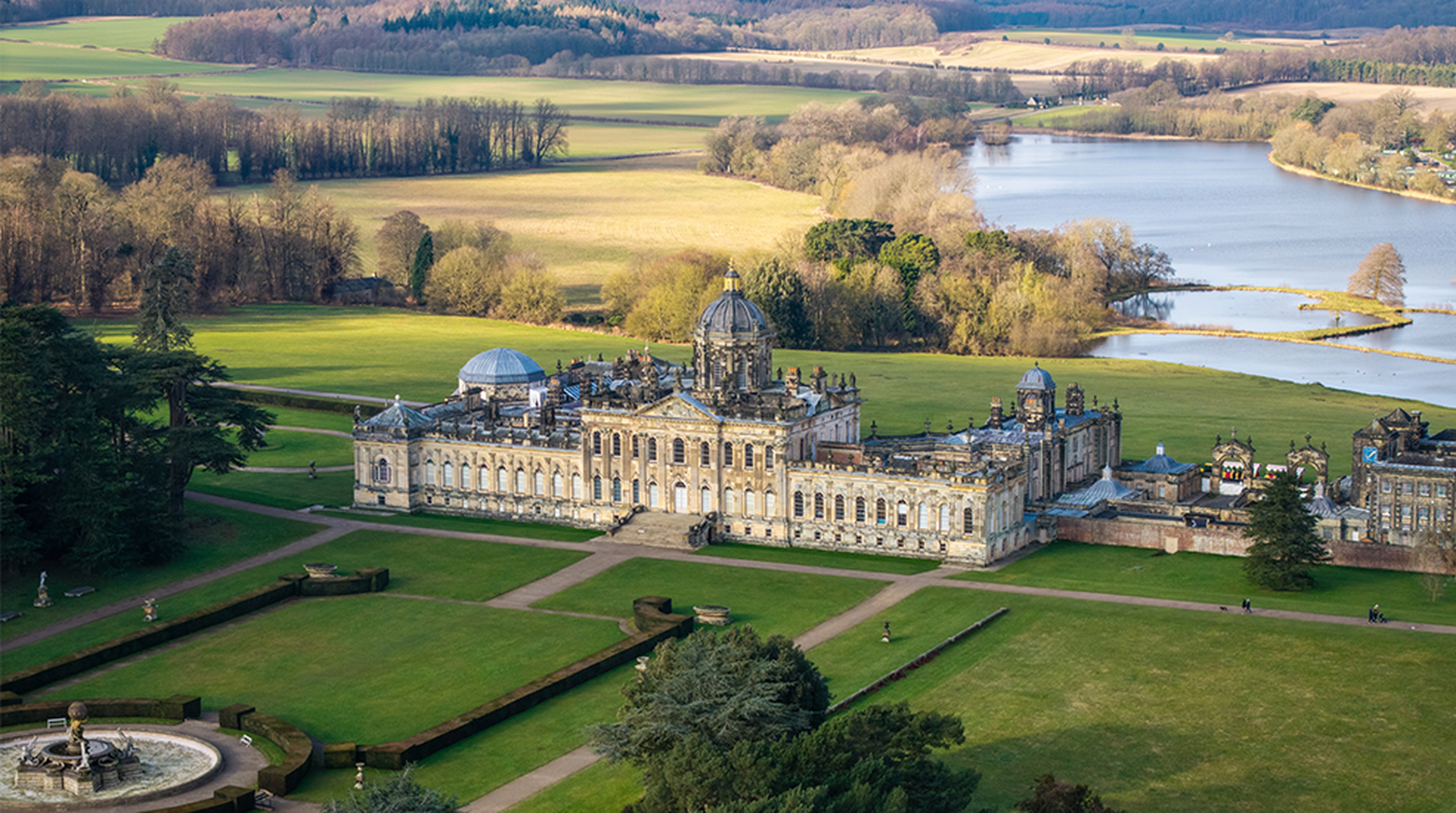 Aerial view of Castle Howard stately home in North Yorkshire with gardens and lake