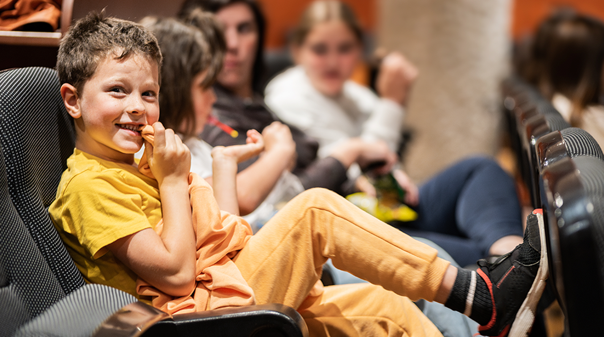 Little boy in the cinema smiling