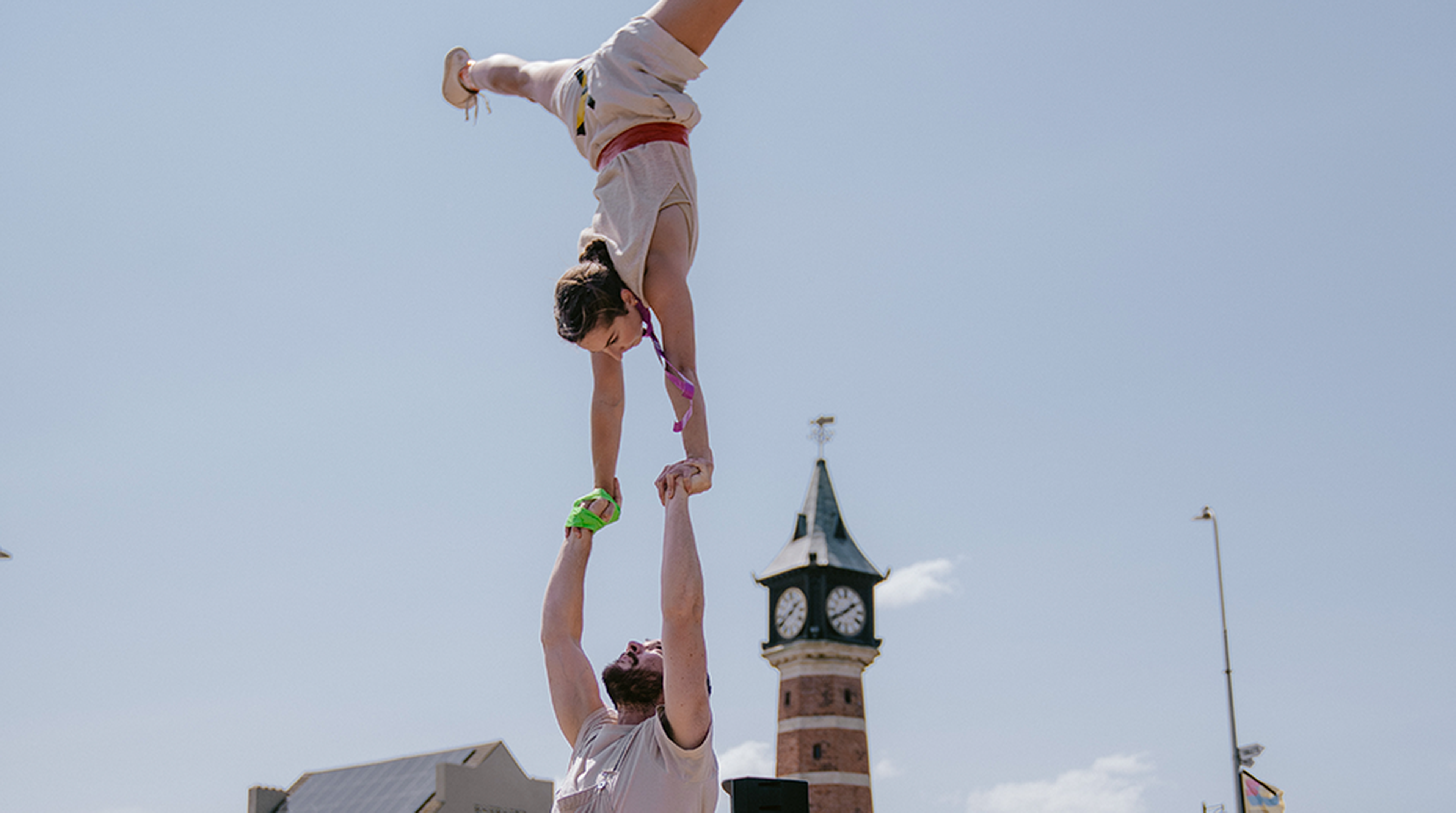 A man and woman doing acrobatics at SO Festival