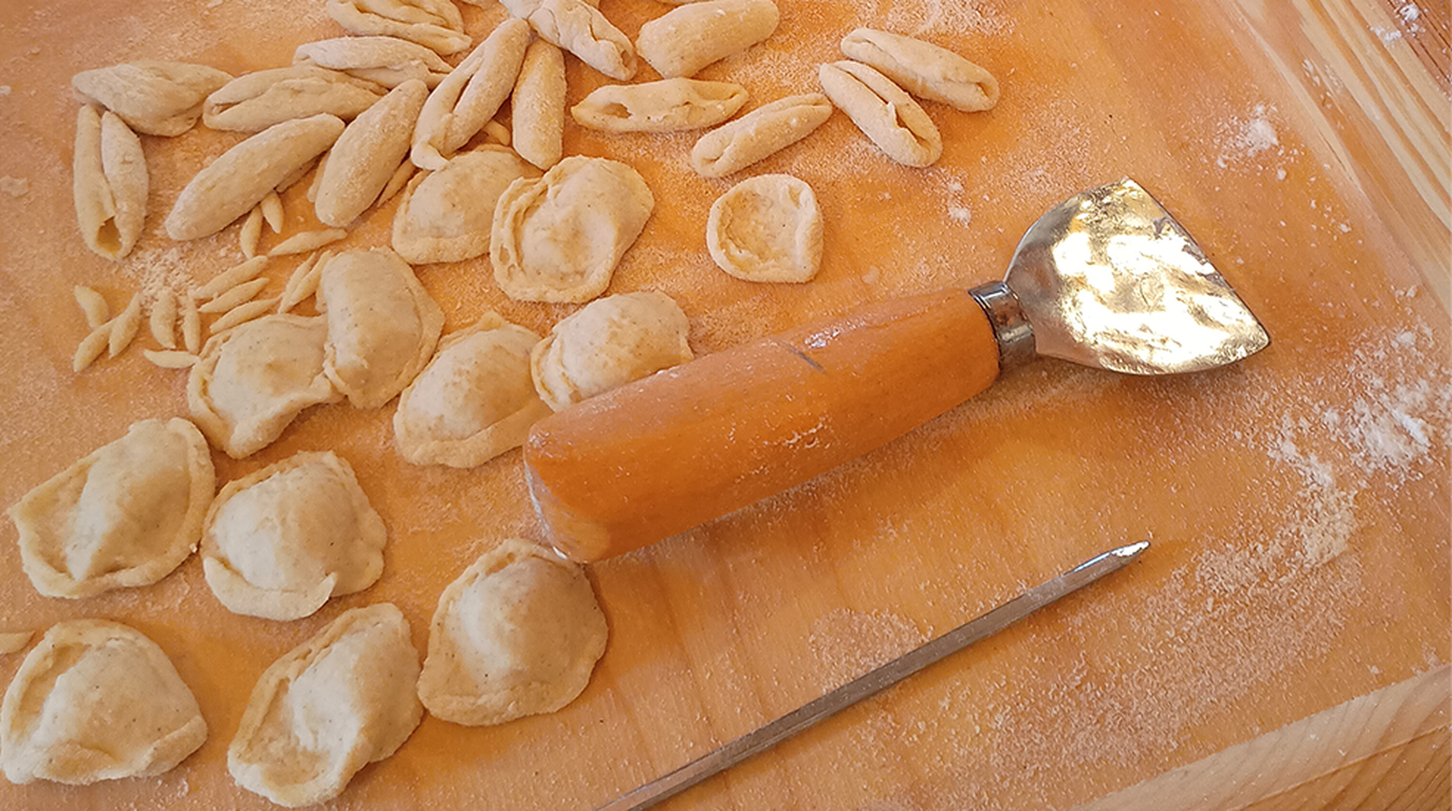 Close up of pasta and pasta making tools