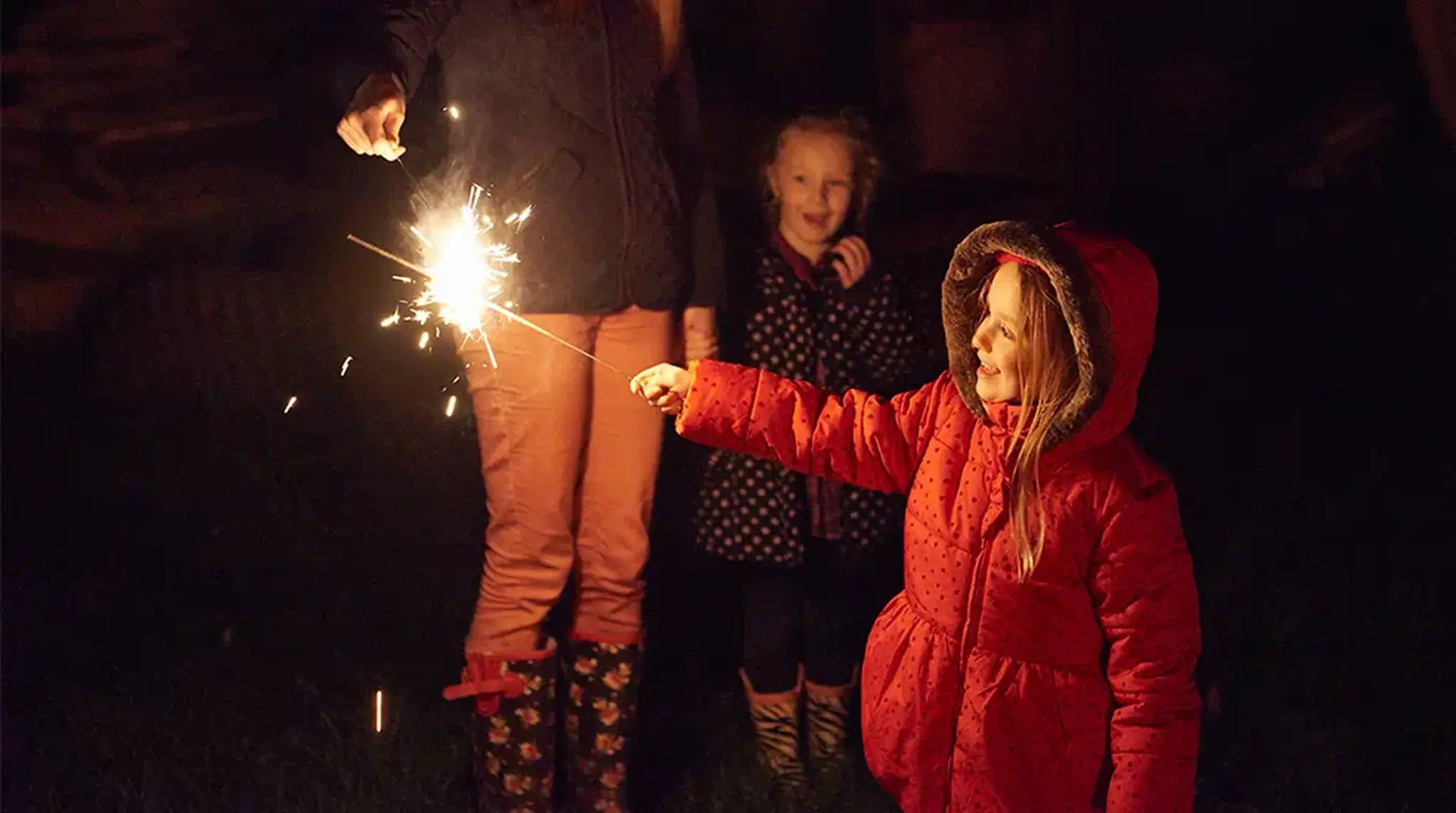 Little girl holding sparkler