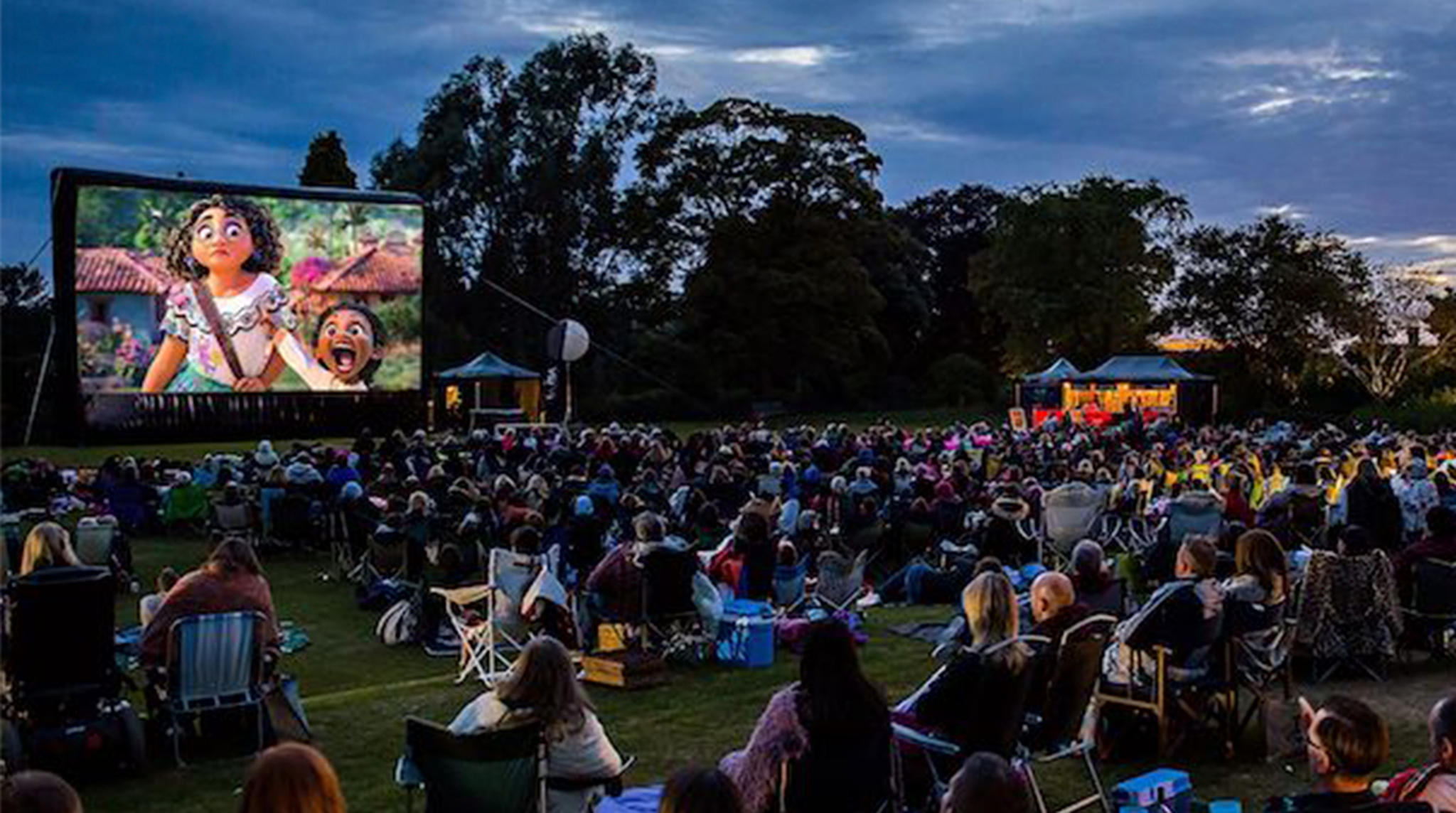 Crowd watching a movie outside at Kew Gardens