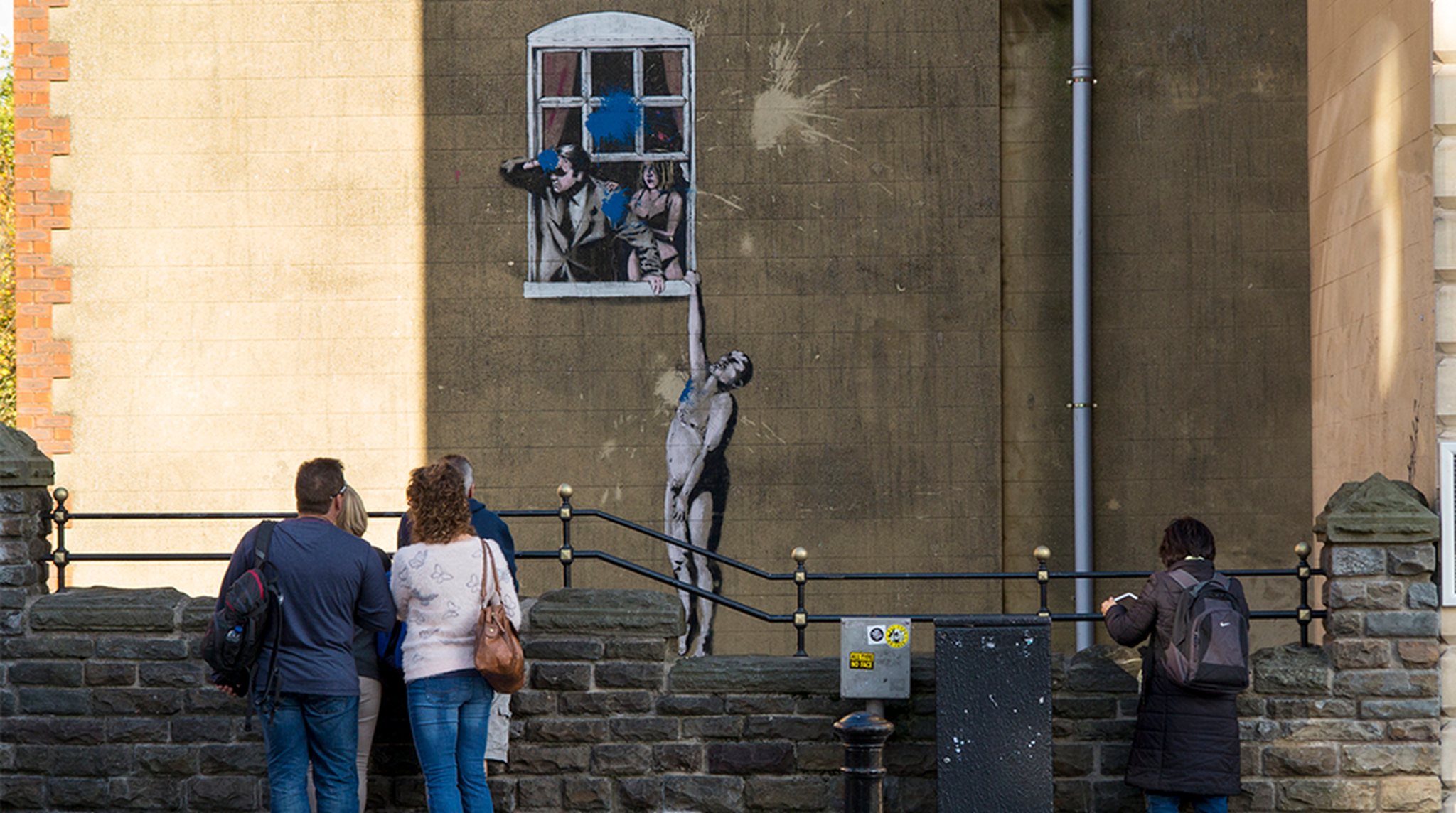 Viewed from Park Street, Naked Man - is an original example of Banksy grafitti artwork in Bristol which itself has been defaced by a paint bomb attack. It still attracts the attention of many visitors to Bristol.