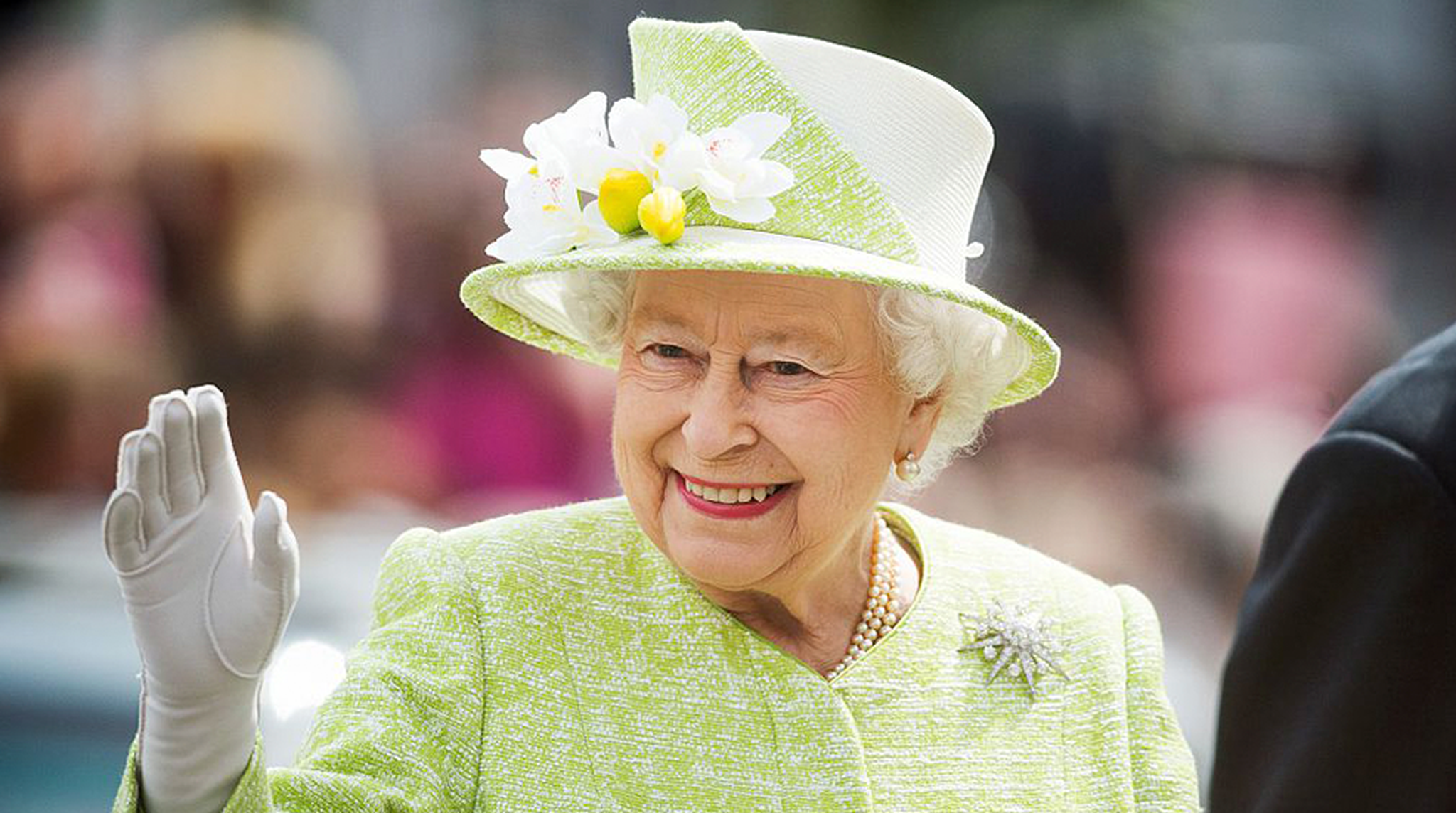 Queen Elizabeth II waves during a walk about around Windsor on her 90th Birthday on April 21, 2016 in Windsor, England.