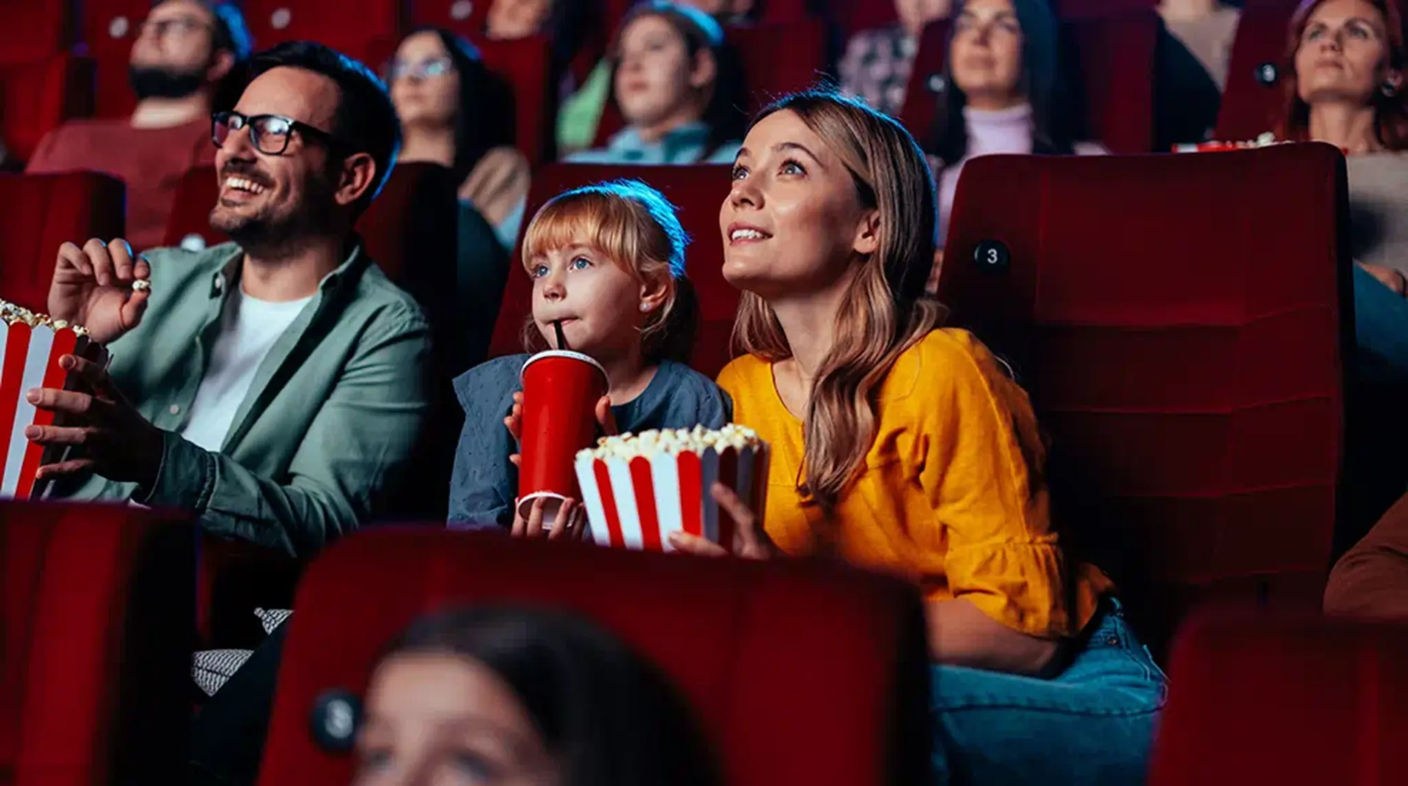 Family of three at cinema
