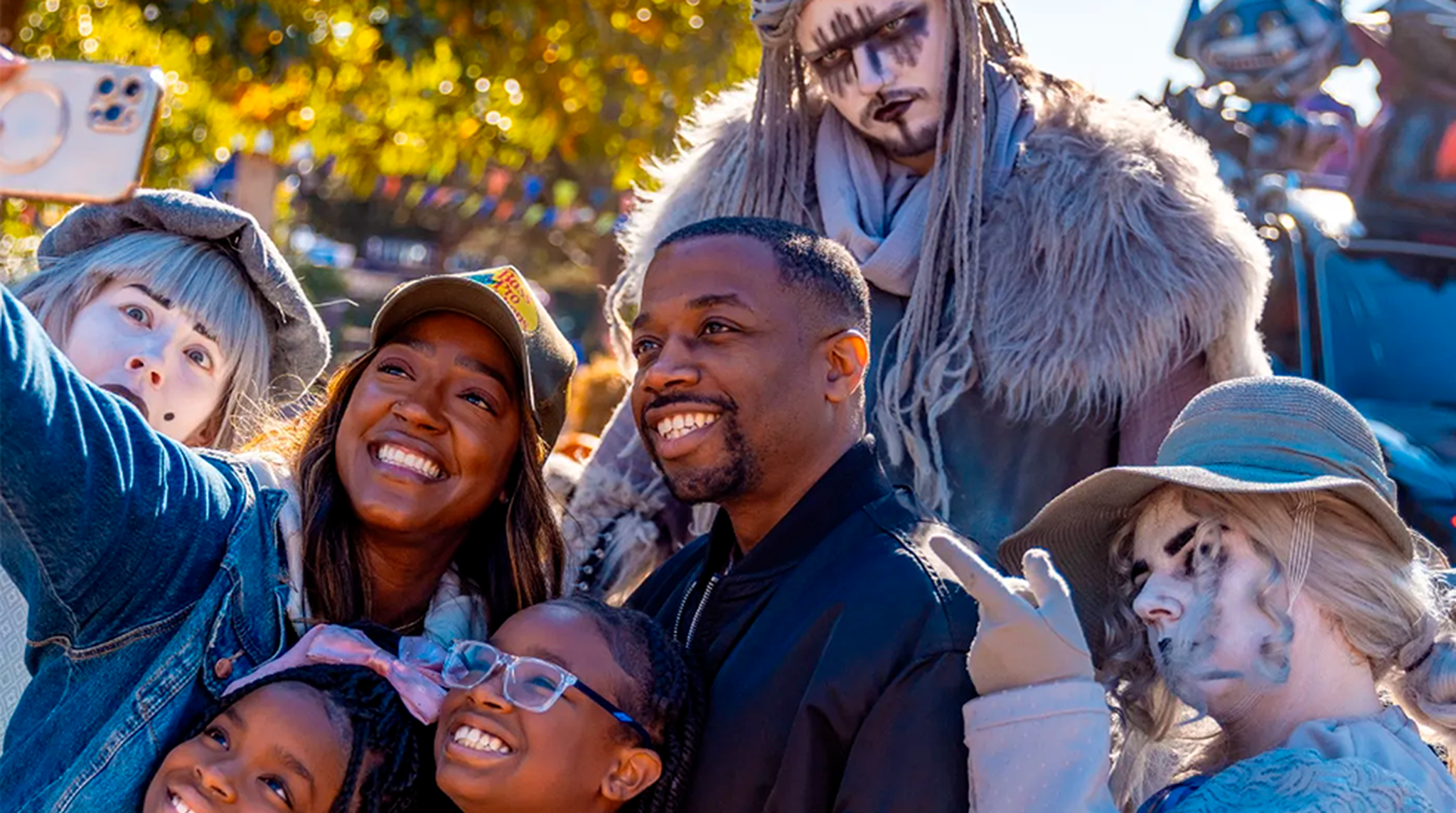 Family posing with spooky actors at Alton Towers Scarefest