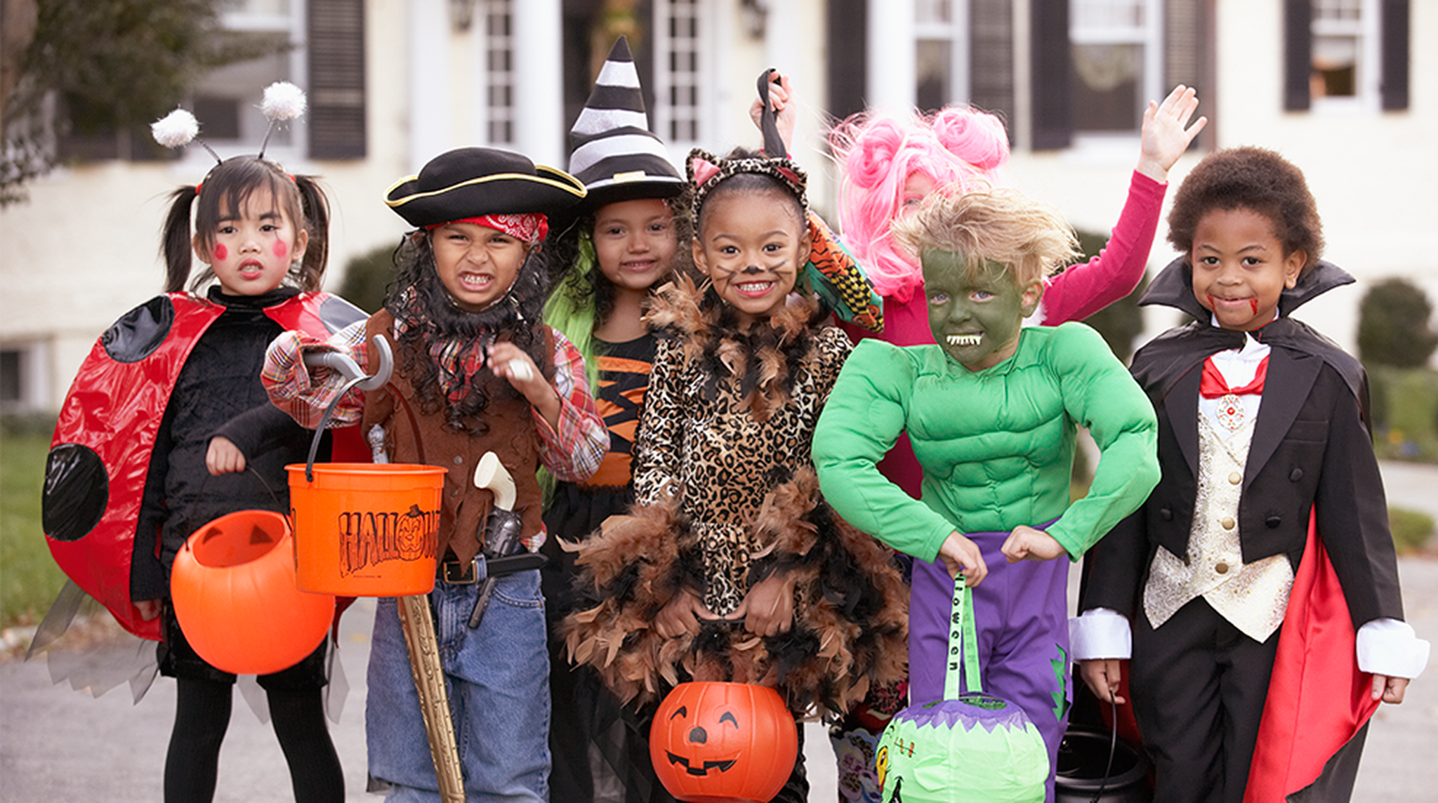 Group of kids dressed up in Halloween costumes