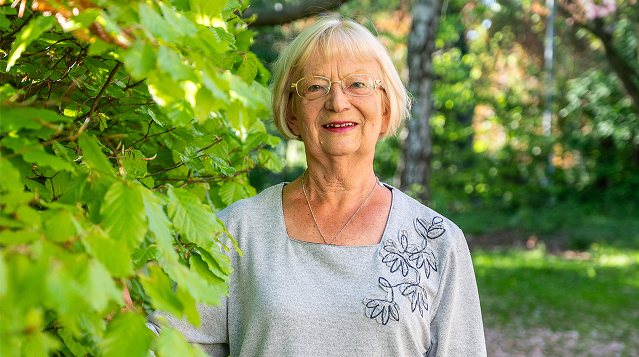 Portrait of Elaine Allman outdoors in greenery