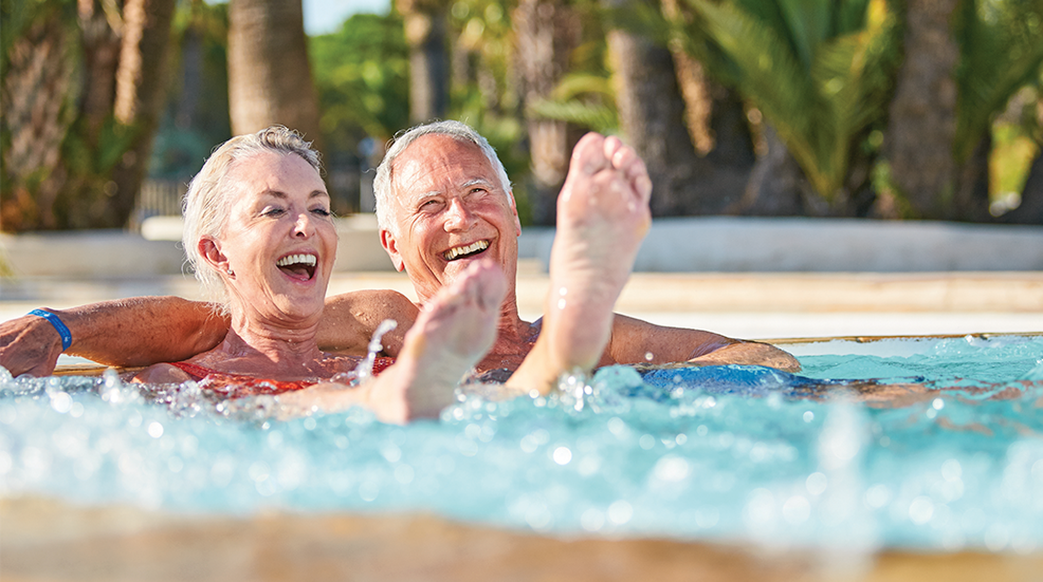 Mature couple enjoying pool