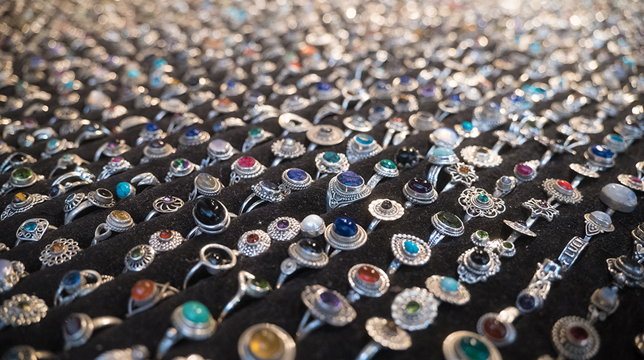 Lots of unique antique or vintage silver rings at a jewlery stand in Portobello Market