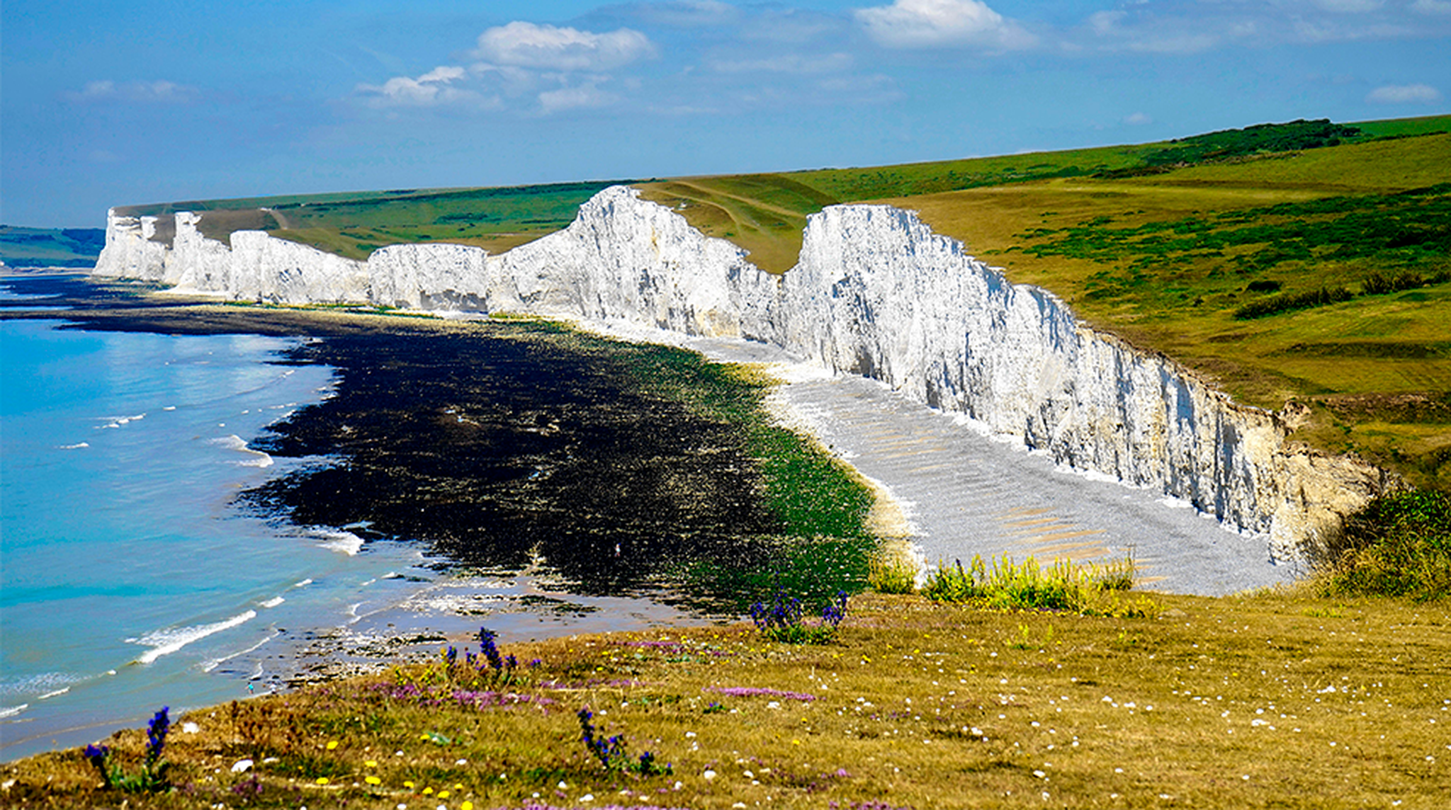Scenic view of the iconic white cliffs of Seven Sisters, Sussex, with a tranquil seascape