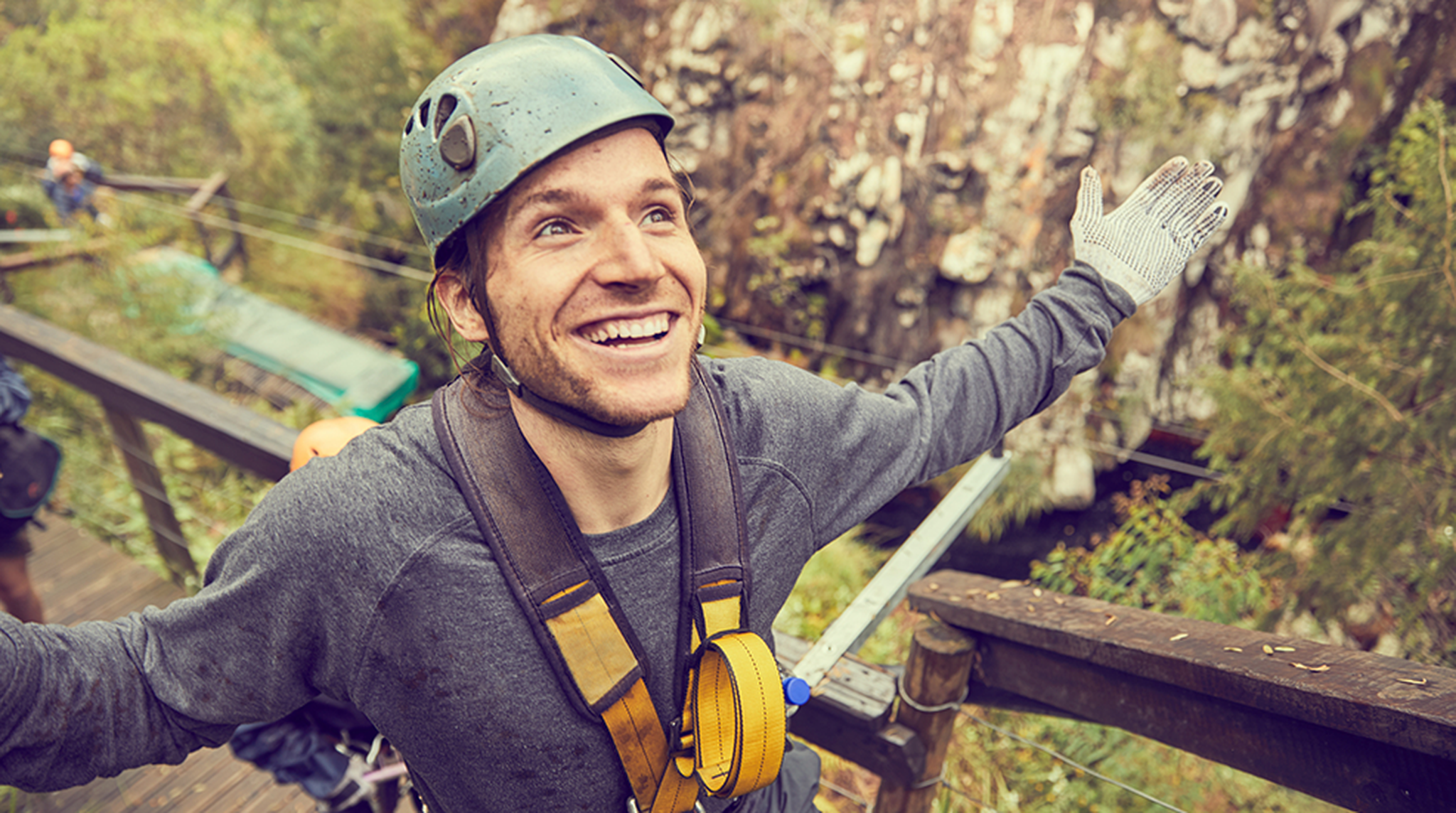 carefree man preparing to zip line