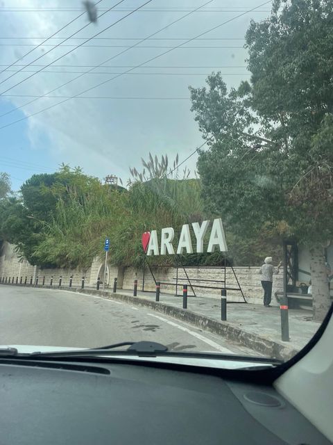 A sign at the entrance to Araya, where Robert and his family stayed for much of their displacement.