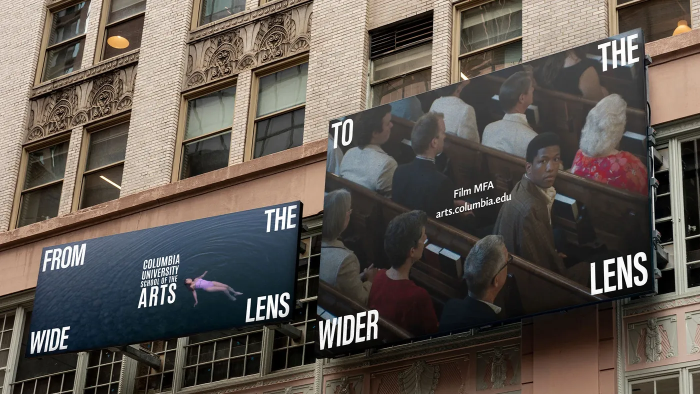 Two large billboards on a building