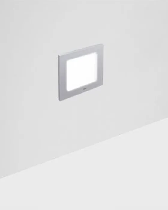 Simon 835 square courtesy luminaire semi-recessed in light grey wall with light on