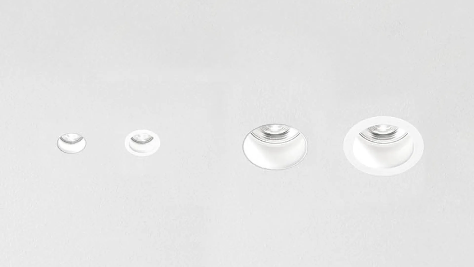 Simon Hole range — four cylindrical downlights aligned on grey background