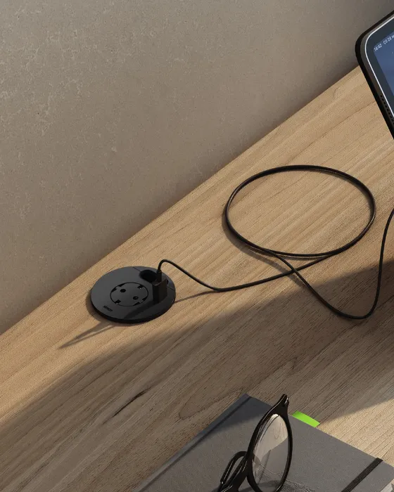 Simon Flash on a wooden nightstand with phone, glasses and notebooks — warm interior atmosphere