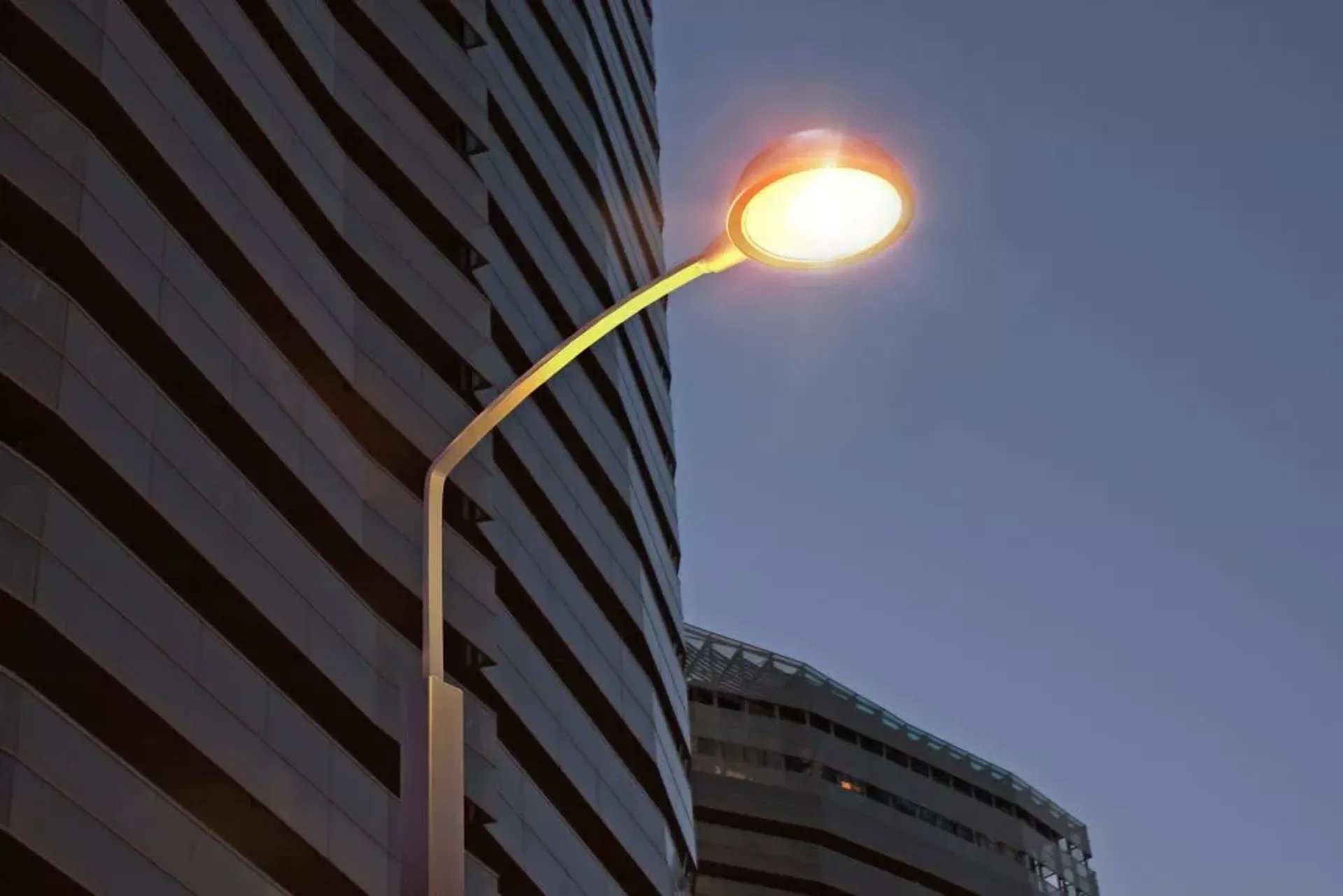 Simon Alya Istanium LED decorative urban luminaire — lateral or suspended fixing on dark background