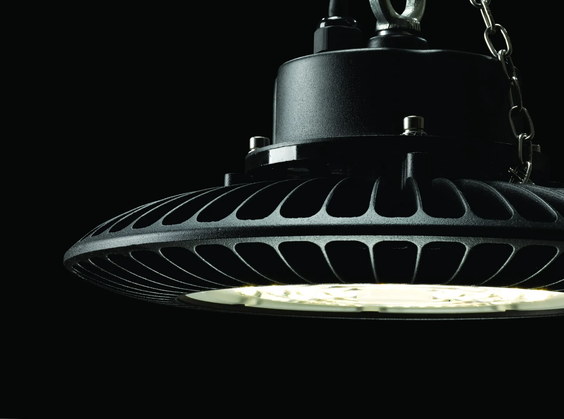 Simon 716 industrial suspended luminaire switched on in industrial space