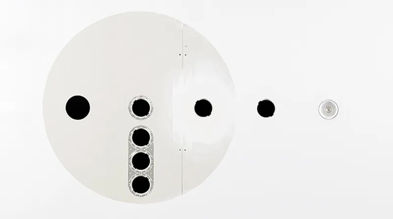 Sistema patentado X-LESS de Simon Loop — integración perfecta de la luminaria en la pared
