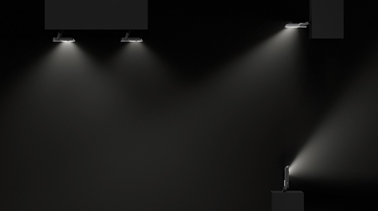 Simon 880 watertight industrial spotlights in operation projecting light onto surfaces in an industrial environment