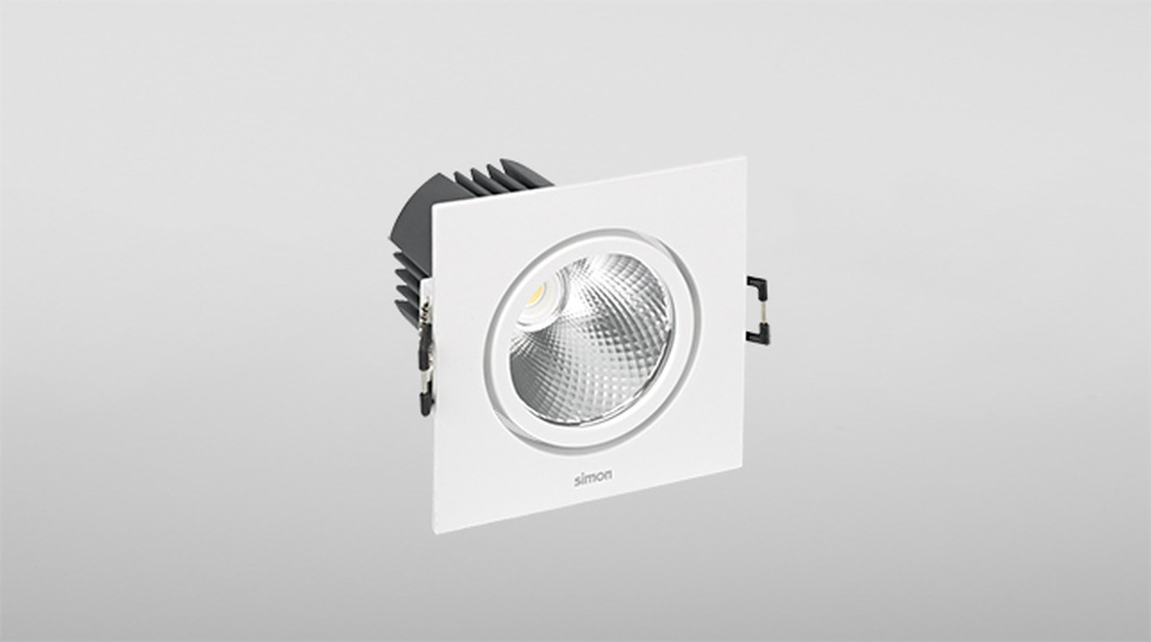 Square Simon 704 downlight showing optical body, interchangeable frame and side springs
