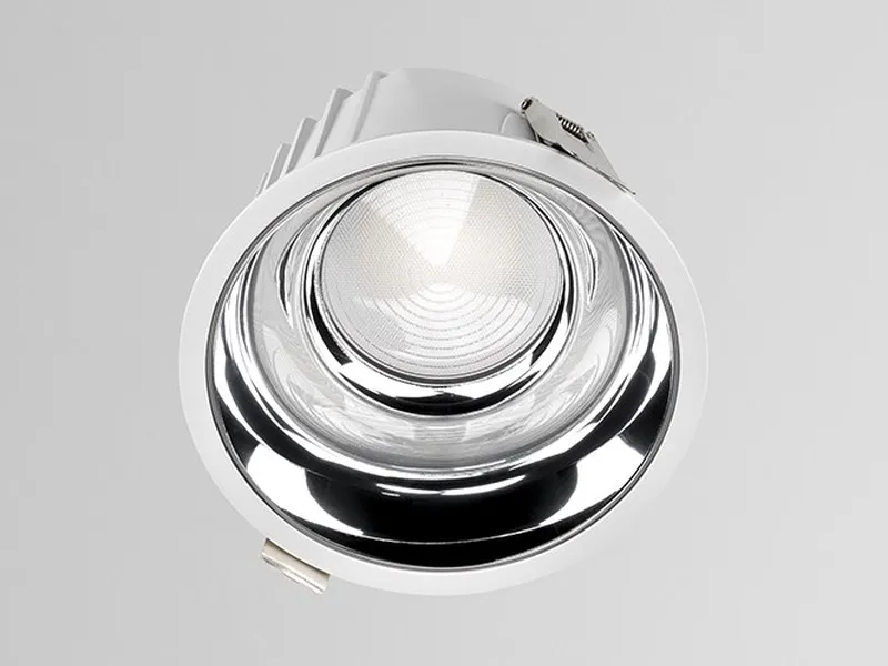 Close-up of the Simon 800 downlight optic — lens and specular reflector for uniform light with UGR<19