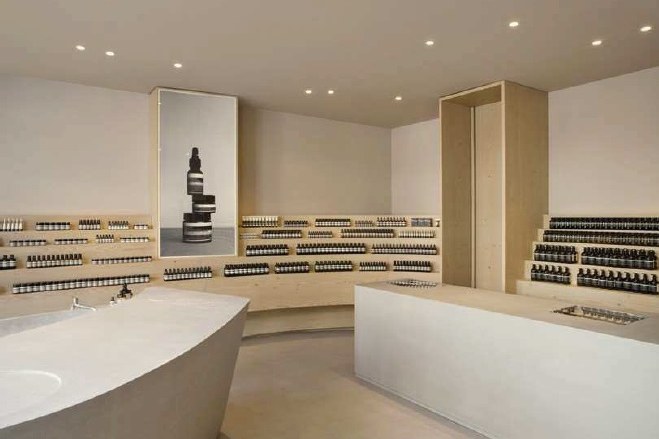 Aesop retail store with Simon 703 downlights on ceiling lighting cosmetic shelves
