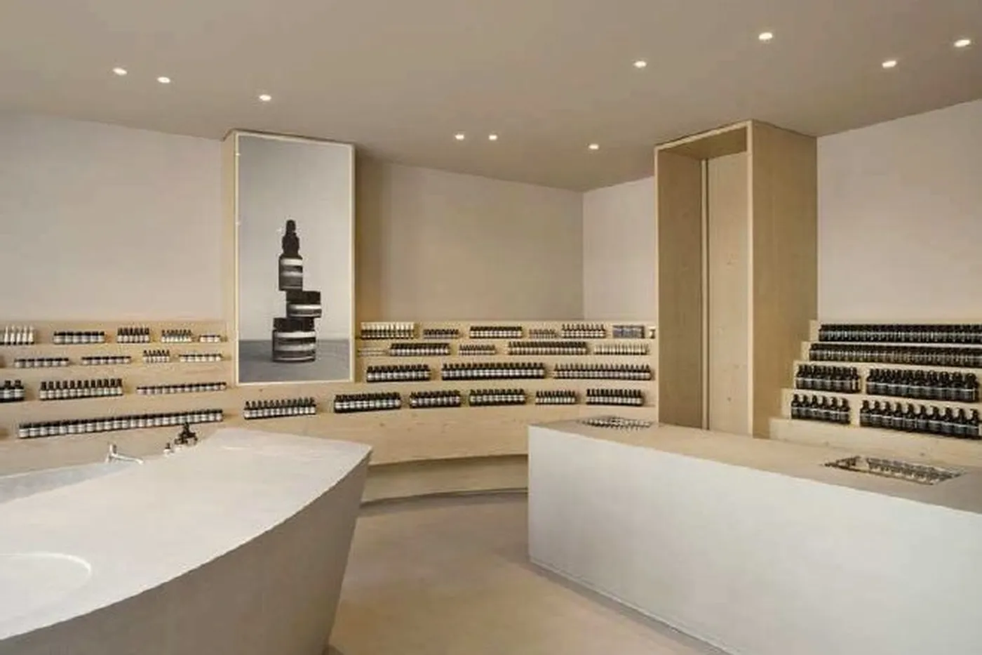 Aesop retail store with Simon 703 downlights on ceiling lighting cosmetic shelves