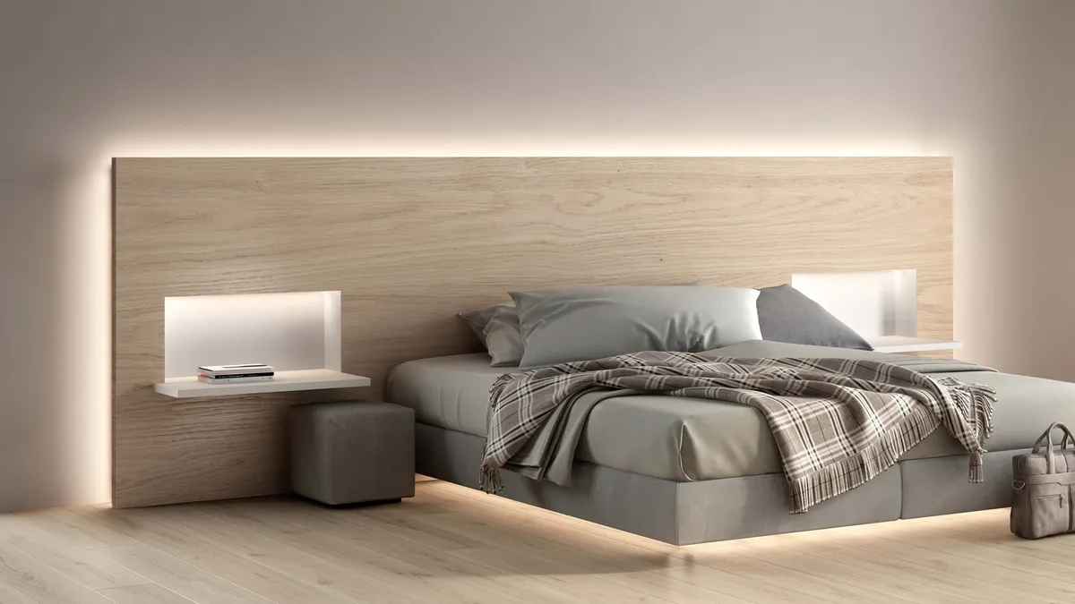 Bedroom with a wooden headboard and a Simon 810 LED line creating a halo of light