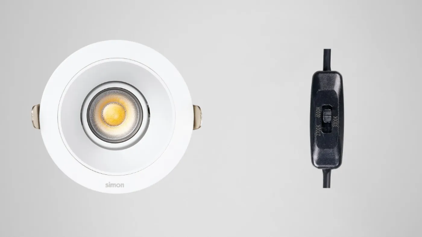 Simon 709 white downlight switched on with warm light and dip-switch device for temperature selector