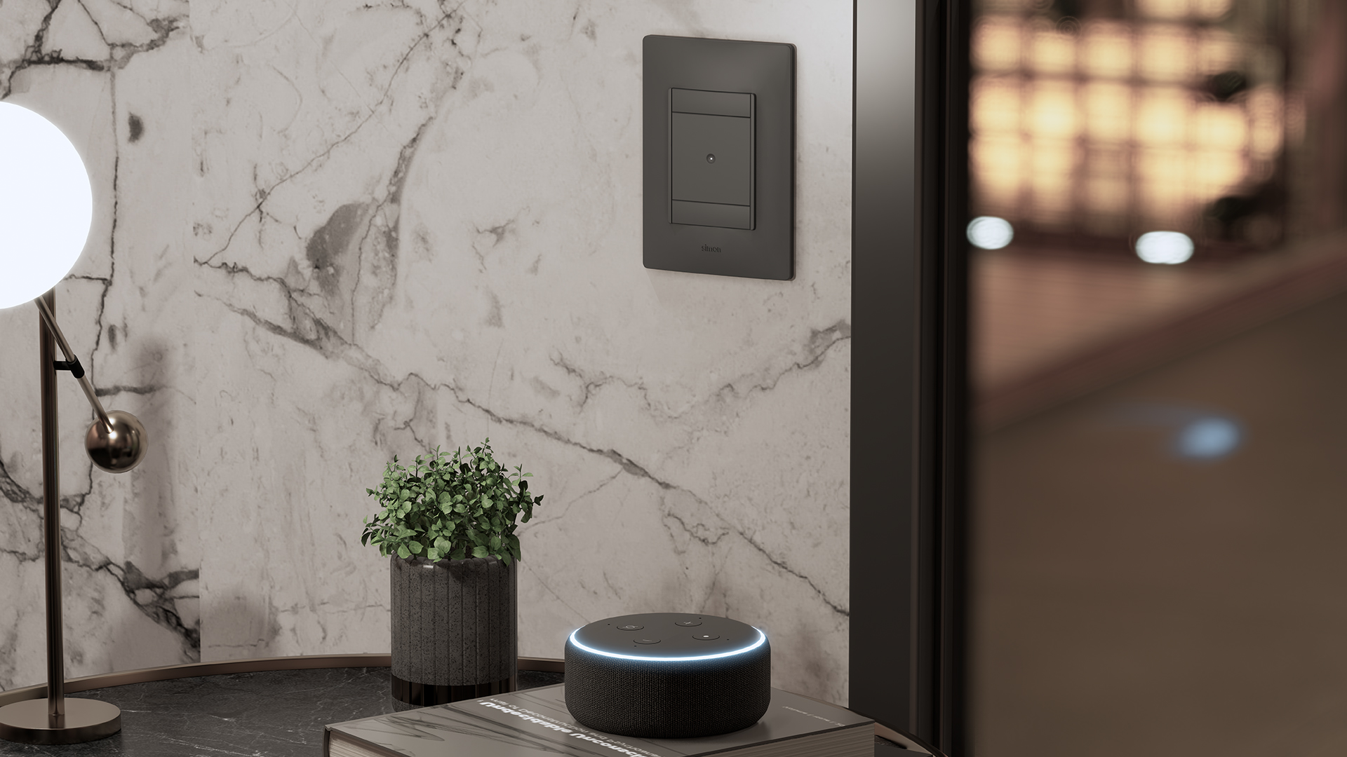 Living room setting with a black Simon 26 iO switch on a white marble wall, an Amazon Echo speaker on the coffee table and a spherical lamp.