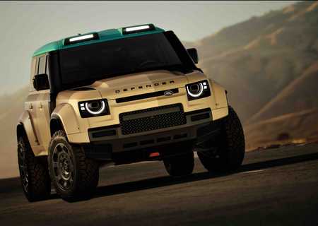 Tan and green SUV on a mountain road, showcasing rugged terrain capabilities with distinctive headlights and large off-road tires.
