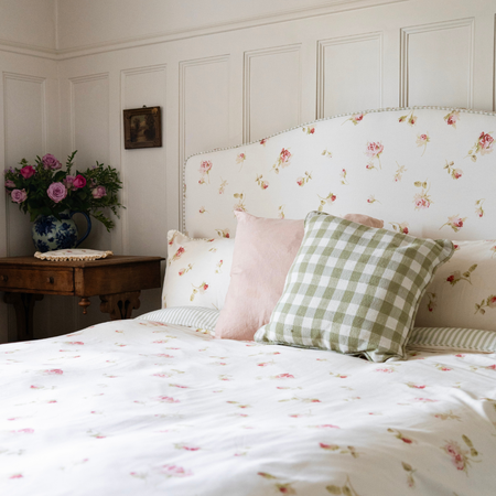 Nostalgic rose ruffle bed, floral and stripe linen, with green gingham cushion and linen pale pink cushion