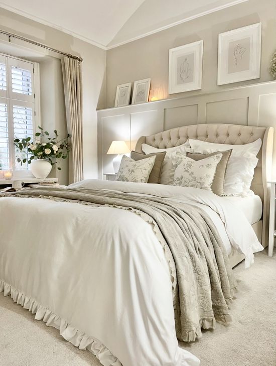 Cream bed with white frilly duvet and grey embroidered frilly throw