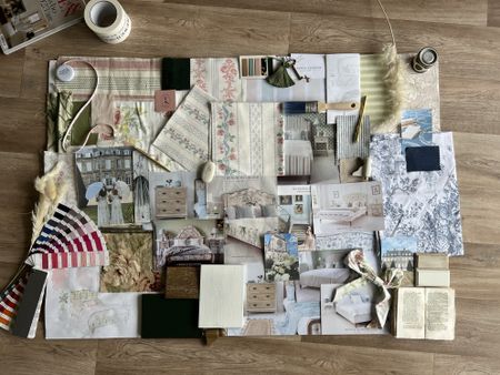 Mood board of various patterns, textures, and colours on a wooden floor, including fabric, wallpaper samples, and decorative elements depicting upcoming trends in furniture and homeware.
