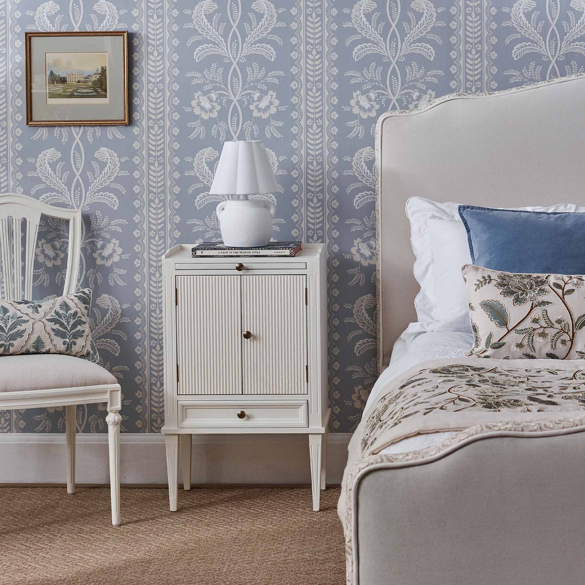 Gustavian white fluted wood bedside cabinet styled with our Velvet upholstered Cloud dreamer bed