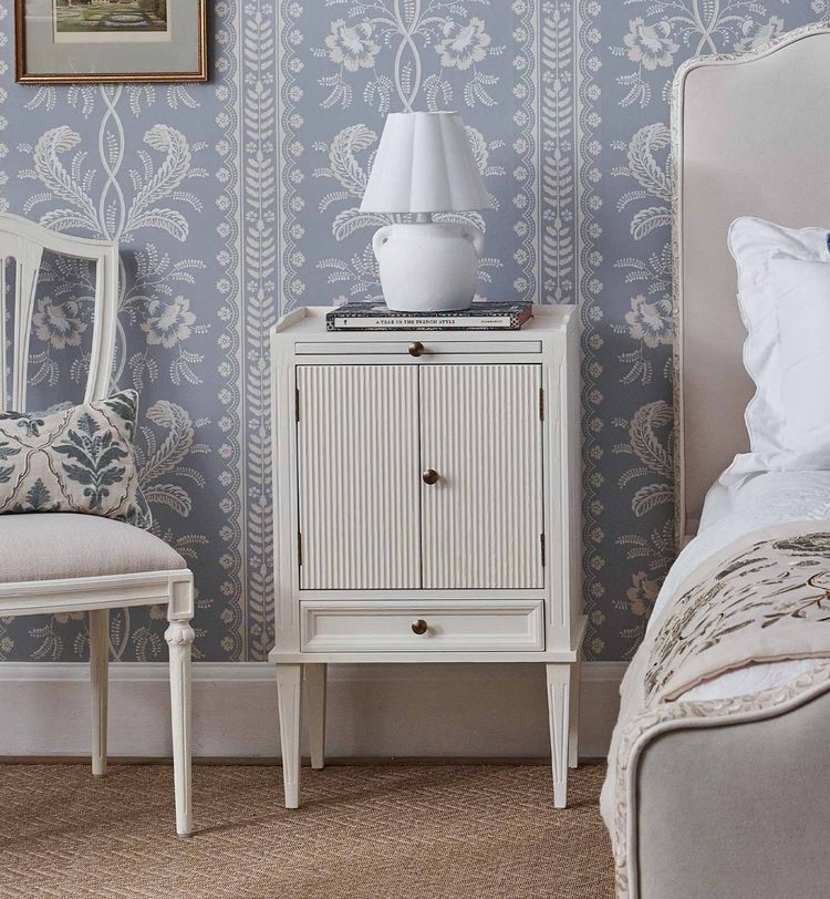 Gustavian white fluted wood bedside cabinet styled with our Velvet upholstered Cloud dreamer bed