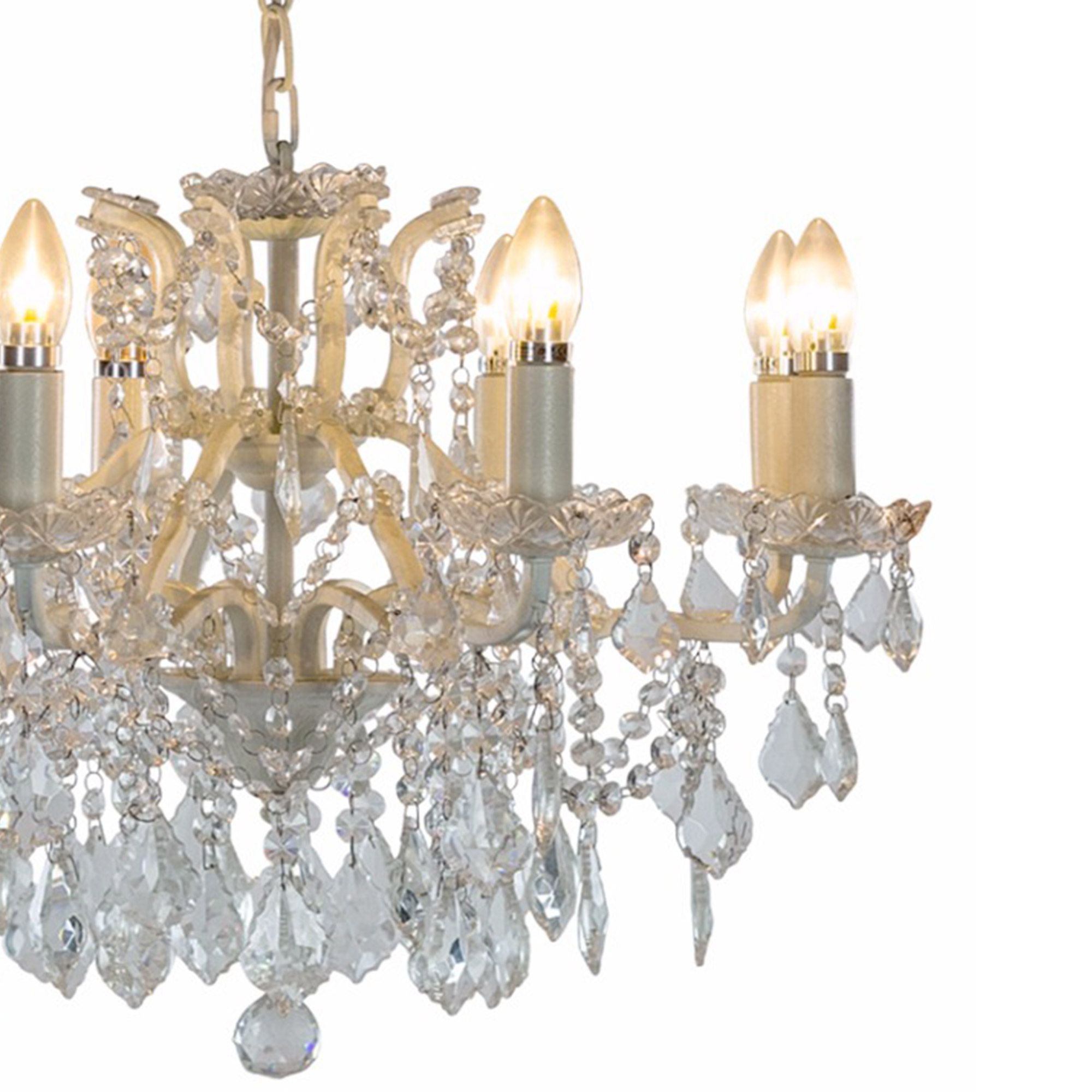 Elegant crystal chandelier with lit candle-style bulbs, ornate detailing, and dangling crystal pendants, set against a white background.