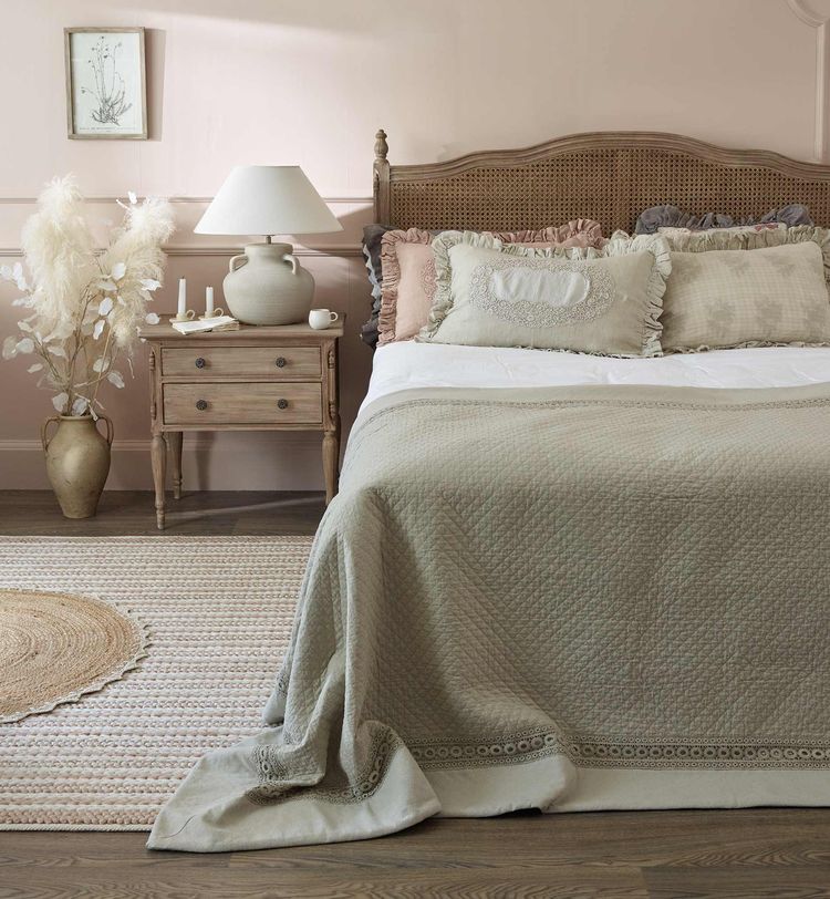 Clair de Lune Rattan bed styled with Jute rugs and ruffle cushions