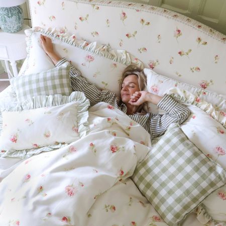 Regency rose floral upholstered bed with green gingham cushions