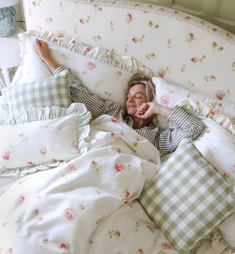 Regency rose floral upholstered bed with green gingham cushions