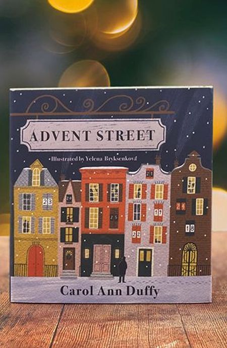 Cover of "Advent Street" by Carol Ann Duffy, illustrated by Yelena Bryksenkova, featuring colorful townhouses and a snowy scene.